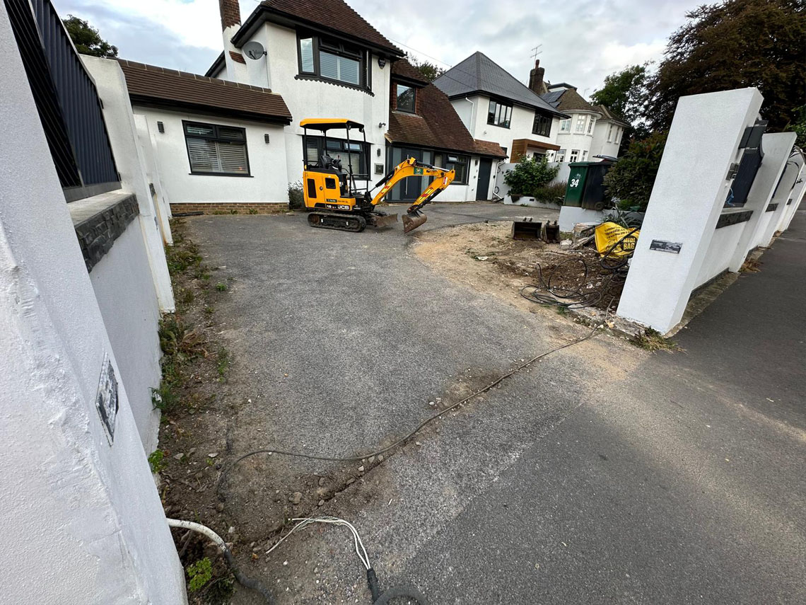Before — old cracked driveway
